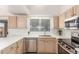 Bright kitchen showcasing white countertops, stainless steel appliances, modern cabinets and natural light at 14561 W Winding Trl, Surprise, AZ 85374