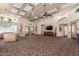 Spacious lounge with plenty of natural light, lounge seating and decorations at 14561 W Winding Trl, Surprise, AZ 85374