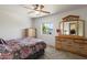 Comfortable bedroom with carpet, dressers and large window with neighborhood views at 14922 N 172Nd Dr, Surprise, AZ 85388