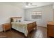 Bright bedroom featuring a ceiling fan, tile floors, and a warm, inviting atmosphere at 14922 N 172Nd Dr, Surprise, AZ 85388