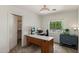 Bright office/bedroom with desk setup, and a large window with neighborhood views at 14922 N 172Nd Dr, Surprise, AZ 85388