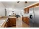 View of kitchen with stainless steel appliances and view to the living room at 14922 N 172Nd Dr, Surprise, AZ 85388