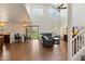 Spacious living room with high ceilings, ample natural light, and staircase at 14922 N 172Nd Dr, Surprise, AZ 85388