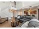 Spacious living room featuring staircase and views to the kitchen and dining area at 14922 N 172Nd Dr, Surprise, AZ 85388
