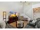 Open-concept living room with a staircase, tall ceilings, and comfortable seating at 14922 N 172Nd Dr, Surprise, AZ 85388