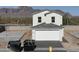 New two-story home featuring a spacious two-car garage, modern design, and views of the nearby mountains at 1577 N Pueblo Dr, Apache Junction, AZ 85120