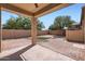The backyard patio has brick pavers, a covered seating area, and minimal landscaping at 1710 S Parkcrest St, Gilbert, AZ 85295