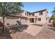 This backyard features brick pavers, a covered seating area, and low-maintenance landscaping at 1710 S Parkcrest St, Gilbert, AZ 85295