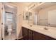Bathroom with double sink vanity, decorative lighting, and a separate toilet and shower room at 1710 S Parkcrest St, Gilbert, AZ 85295