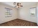 This bedroom offers neutral walls, and a ceiling fan, providing a comfortable retreat at 1710 S Parkcrest St, Gilbert, AZ 85295