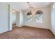 Bright and airy dining area featuring modern lighting and arched windows at 1710 S Parkcrest St, Gilbert, AZ 85295