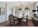 Elegant dining room with stylish furniture, chandelier, and arched windows at 1710 S Parkcrest St, Gilbert, AZ 85295
