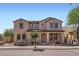 Two-story home with a neutral colored stucco and terracotta roof tiles. Has a covered entryway at 1710 S Parkcrest St, Gilbert, AZ 85295