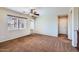 Spacious living area with neutral walls, carpet flooring, and ample natural light from the large window at 1710 S Parkcrest St, Gilbert, AZ 85295