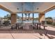 Community picnic area with four picnic tables and a view of the community pool at 1710 S Parkcrest St, Gilbert, AZ 85295