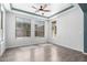 Bedroom featuring beautiful wood floors and large windows at 17853 W Pershing St, Surprise, AZ 85388