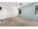 Carpeted bedroom with a ceiling fan, recessed lighting, and an exterior window at 17853 W Pershing St, Surprise, AZ 85388