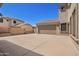 Wide driveway leading to a two-car garage at 17853 W Pershing St, Surprise, AZ 85388