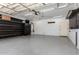 A clean, well-lit garage with ample storage space and functional layout at 17853 W Pershing St, Surprise, AZ 85388