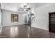 Open concept living room with beautiful wood flooring and natural light at 17853 W Pershing St, Surprise, AZ 85388