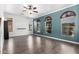 Large living room with beautiful wood flooring and natural light at 17853 W Pershing St, Surprise, AZ 85388