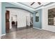 Open-concept living room with wood floors, recessed lighting, and an archway at 17853 W Pershing St, Surprise, AZ 85388