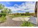 Landscaped backyard featuring artificial turf, brick pavers, and scenic mountain views at 1854 W Fetlock Trl, Phoenix, AZ 85085