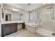 Bathroom with a soaking tub, shower and double vanity at 1854 W Fetlock Trl, Phoenix, AZ 85085