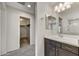 Bathroom with a single sink vanity and a walk-in closet at 1854 W Fetlock Trl, Phoenix, AZ 85085