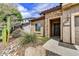 Close up of the front door with decorative stonework and desert landscaping at 1854 W Fetlock Trl, Phoenix, AZ 85085