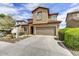 Charming two-story home with a private two-car garage and desert landscaping at 1854 W Fetlock Trl, Phoenix, AZ 85085