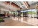 Well-equipped fitness center featuring modern exercise machines, mirrors, and hardwood flooring for a complete workout experience at 1854 W Fetlock Trl, Phoenix, AZ 85085