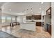 Bright kitchen features granite countertops, dark wood cabinets, and stainless appliances at 1854 W Fetlock Trl, Phoenix, AZ 85085