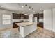 Well-lit kitchen boasts granite countertops, stainless steel appliances, and a large center island at 1854 W Fetlock Trl, Phoenix, AZ 85085