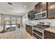 Granite countertops accent the kitchen with stainless appliances, a gas cooktop, and a breakfast nook at 1854 W Fetlock Trl, Phoenix, AZ 85085