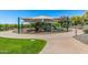 Colorful playground with slides, climbing structures, and shaded seating areas, perfect for outdoor activities at 1854 W Fetlock Trl, Phoenix, AZ 85085