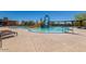 Inviting community pool with water slide, lounge chairs, and ample deck space for relaxation and fun at 1854 W Fetlock Trl, Phoenix, AZ 85085
