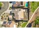 Aerial view of the home's roof with solar panels and backyard with minimal landscaping and a concrete patio at 20082 N 272Nd Ln, Buckeye, AZ 85396