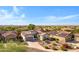 An aerial view of the home and the surrounding neighborhood showcasing desert landscaping at 20082 N 272Nd Ln, Buckeye, AZ 85396