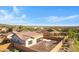 This aerial view showcases the backyard, solar panels, and proximity to desert landscaping at 20082 N 272Nd Ln, Buckeye, AZ 85396