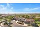 Nice aerial view showcases a well-maintained residential area, featuring lush greenery and tile-roofed homes at 20082 N 272Nd Ln, Buckeye, AZ 85396
