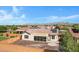View of the backyard showcasing patio space, minimal landscaping, and a view of the surrounding community at 20082 N 272Nd Ln, Buckeye, AZ 85396