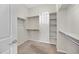 Walk-in closet provides ample storage with built-in shelves and rods for optimal organization at 20082 N 272Nd Ln, Buckeye, AZ 85396