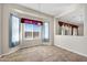 Bright dining area with neutral paint, tile floors, lots of natural light and attractive light fixture at 20082 N 272Nd Ln, Buckeye, AZ 85396