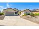A lovely single-Gathering home featuring a well-manicured yard and a spacious two-car garage at 20082 N 272Nd Ln, Buckeye, AZ 85396