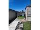 An exterior view of a backyard with artificial grass at 2011 N 26Th Cir, Mesa, AZ 85213