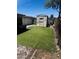 A backyard with artificial grass and a shed at 2011 N 26Th Cir, Mesa, AZ 85213