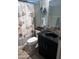 Cozy bathroom with modern vanity, patterned shower curtain, and clean finishes at 2011 N 26Th Cir, Mesa, AZ 85213
