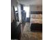Bedroom with dark wood furniture and a large mirror at 2011 N 26Th Cir, Mesa, AZ 85213