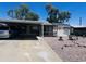 Charming home with covered parking, landscaping, and solar panels at 2011 N 26Th Cir, Mesa, AZ 85213